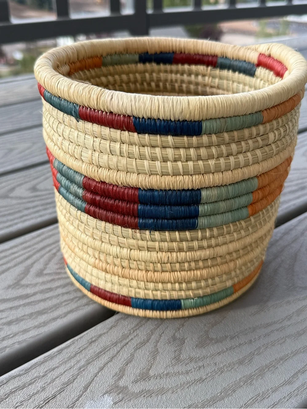 Handwoven Natural Basket with Red and Blue Accents